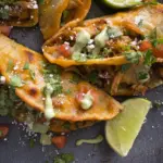 CRISPY CHICKEN CARNITAS TACOS with AVOCADO CILANTRO LIME SAUCE